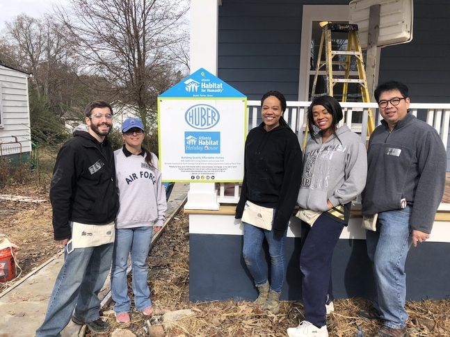 NCCPA employees standing in front of Habitat for Humanity project home